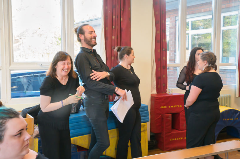 Group of actors in a rehearsal for an upcoming show 